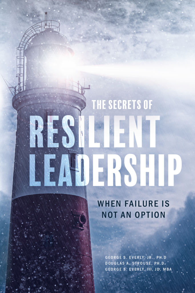 Lighthouse in snow, resilient leadership theme.